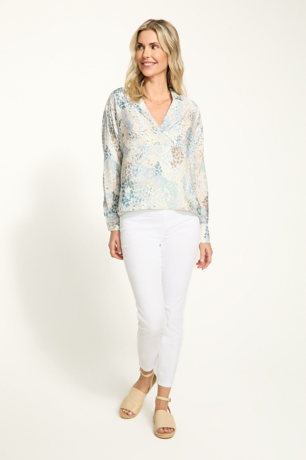 Elevate your wardrobe with the FDJ Popover Long Sleeve Blouse. Featuring a pretty collar and subtle pattern, this blouse adds a touch of elegance to any outfit. Perfect for most occasions, this blouse is a must-have!