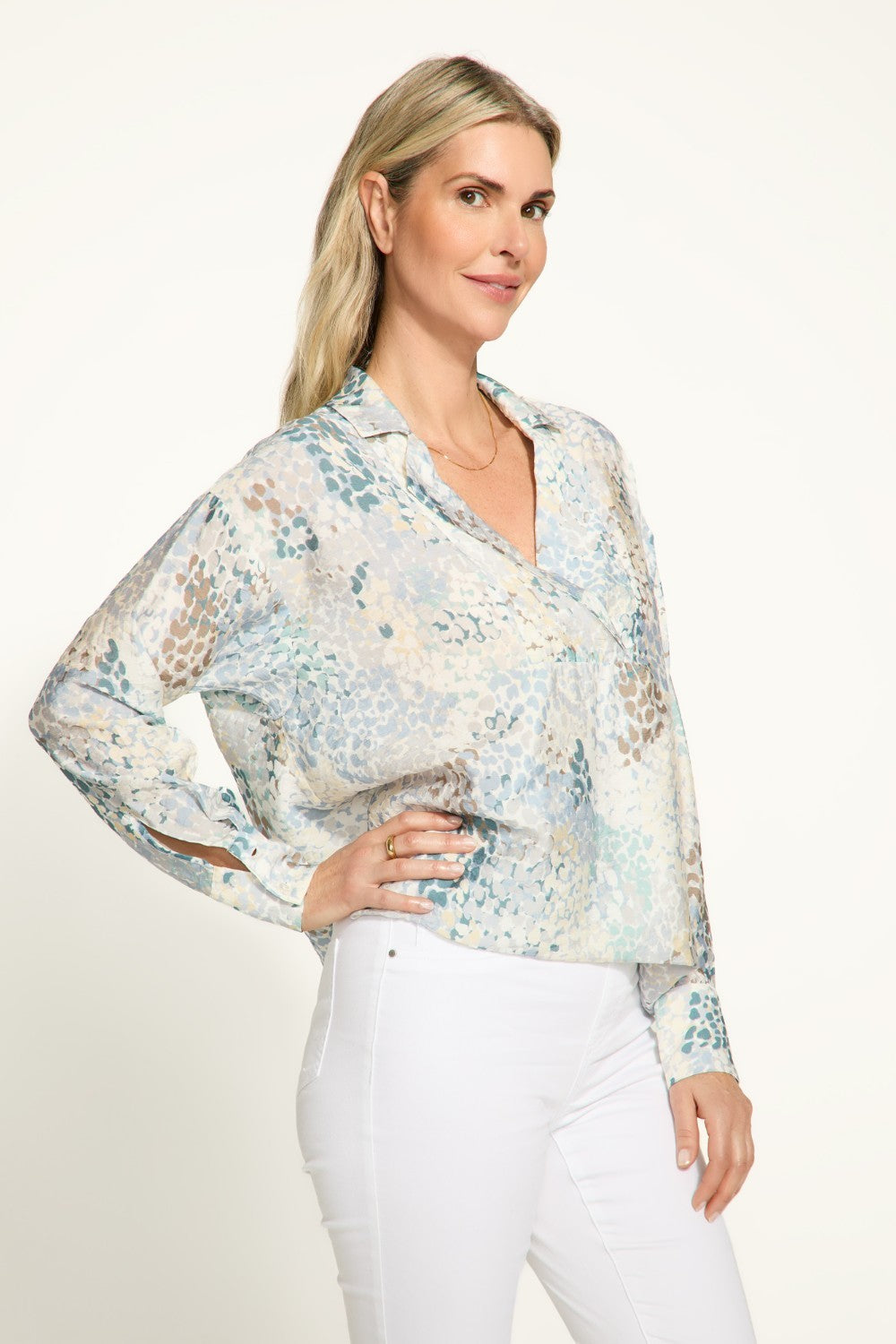 Elevate your wardrobe with the FDJ Popover Long Sleeve Blouse. Featuring a pretty collar and subtle pattern, this blouse adds a touch of elegance to any outfit. Perfect for most occasions, this blouse is a must-have!