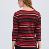 Woman wearing a red and black striped top on a white background