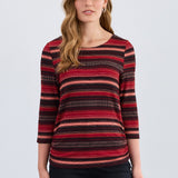 Woman wearing a red and black striped top on a white background