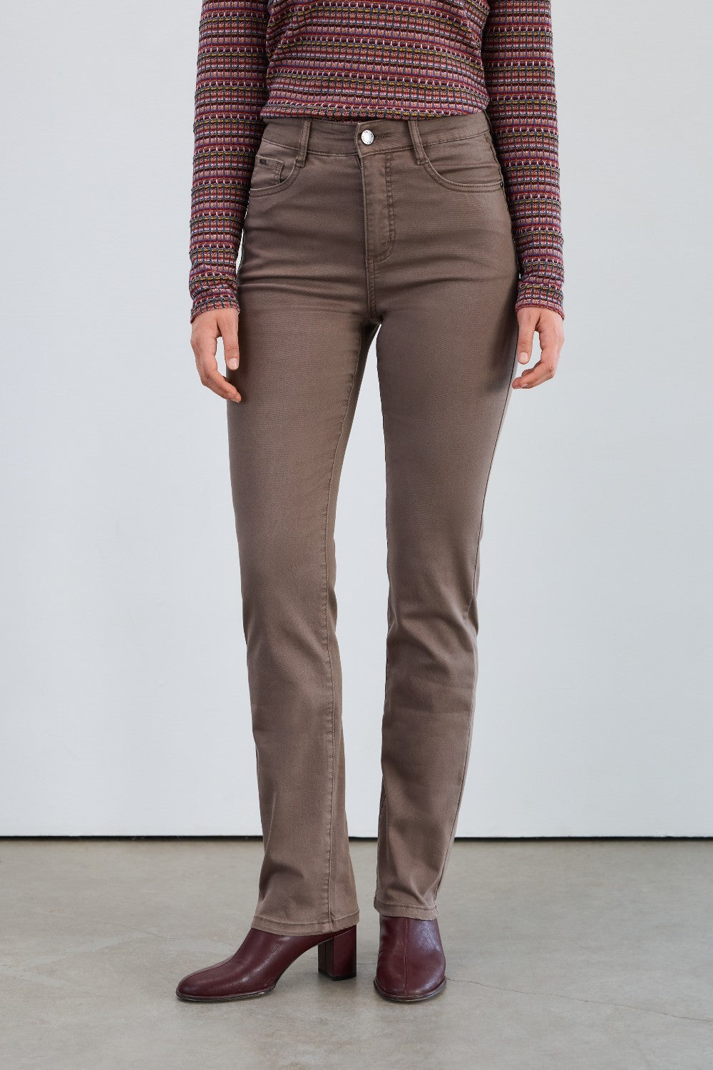 Add a splash of fun to your wardrobe with the FDJ Suzanne Straight Leg in taupe! These pants feature a sleek straight-leg cut that’s both flattering and comfortable. The soft taupe color makes them easy to mix and match, perfect for creating playful, stylish outfits that stand out. Dress them up or down and enjoy a fresh, lively look every time you wear them.