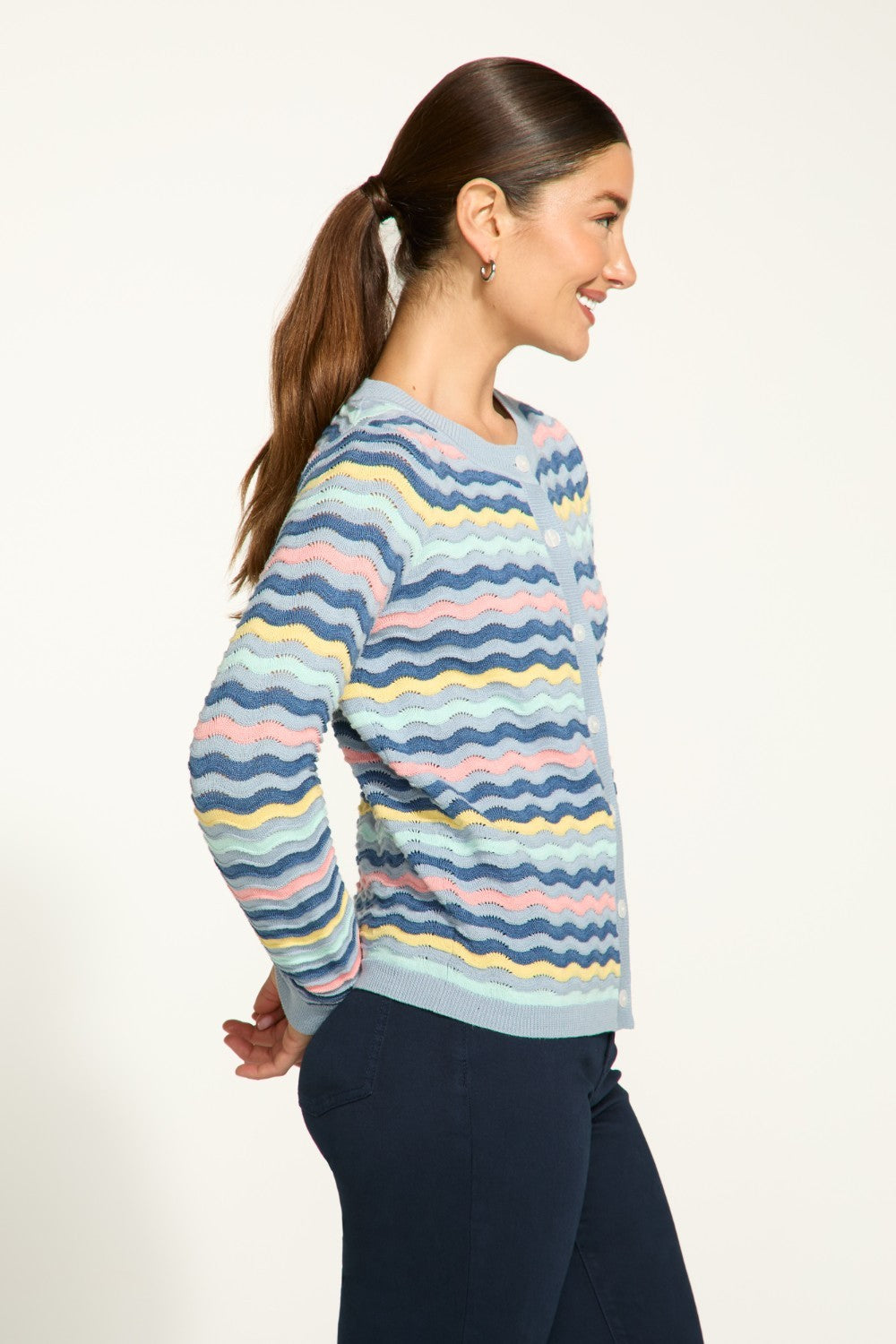 This FDJ Wave Stitch Cardigan features a full button front for easy wear and a lightweight design for added comfort. With a fun wave stitch pattern, this cardigan is ideal for adding a pop of style to any outfit.