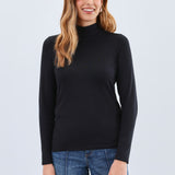 The FDJ Long Sleeve Mock Neck Top is a classic, basic layering piece designed to complement any wardrobe. Its simple yet elegant style makes it perfect for layering under jackets or wearing alone for a clean, polished look. Comfortable and versatile, it’s an essential addition to your everyday collection.