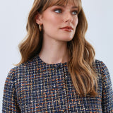 Elevate your wardrobe with the FDJ Tweed Collarless Jacket, a timeless piece that blends classic texture with modern sophistication. Its refined tweed fabric offers warmth and durability, while the collarless design creates a sleek, versatile silhouette perfect for both professional and casual settings. Experience effortless style and comfort that transitions seamlessly from day to night.