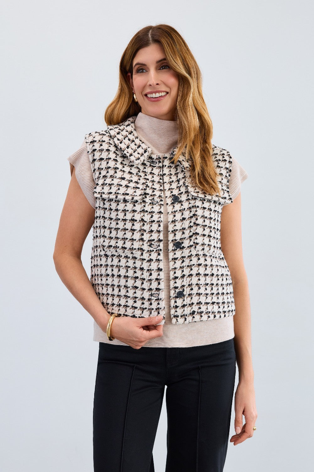 The FDJ Tweed Vest combines timeless style with modern design, featuring a full button front for easy wear and a polished look. Its classic tweed fabric offers a refined texture, making it a versatile addition to your wardrobe. Perfect for layering, this vest supports your style with comfort and sophistication.