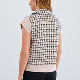 The FDJ Tweed Vest combines timeless style with modern design, featuring a full button front for easy wear and a polished look. Its classic tweed fabric offers a refined texture, making it a versatile addition to your wardrobe. Perfect for layering, this vest supports your style with comfort and sophistication.