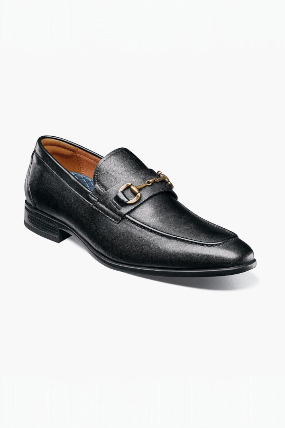Black leather loafer with a gold buckle on a white background