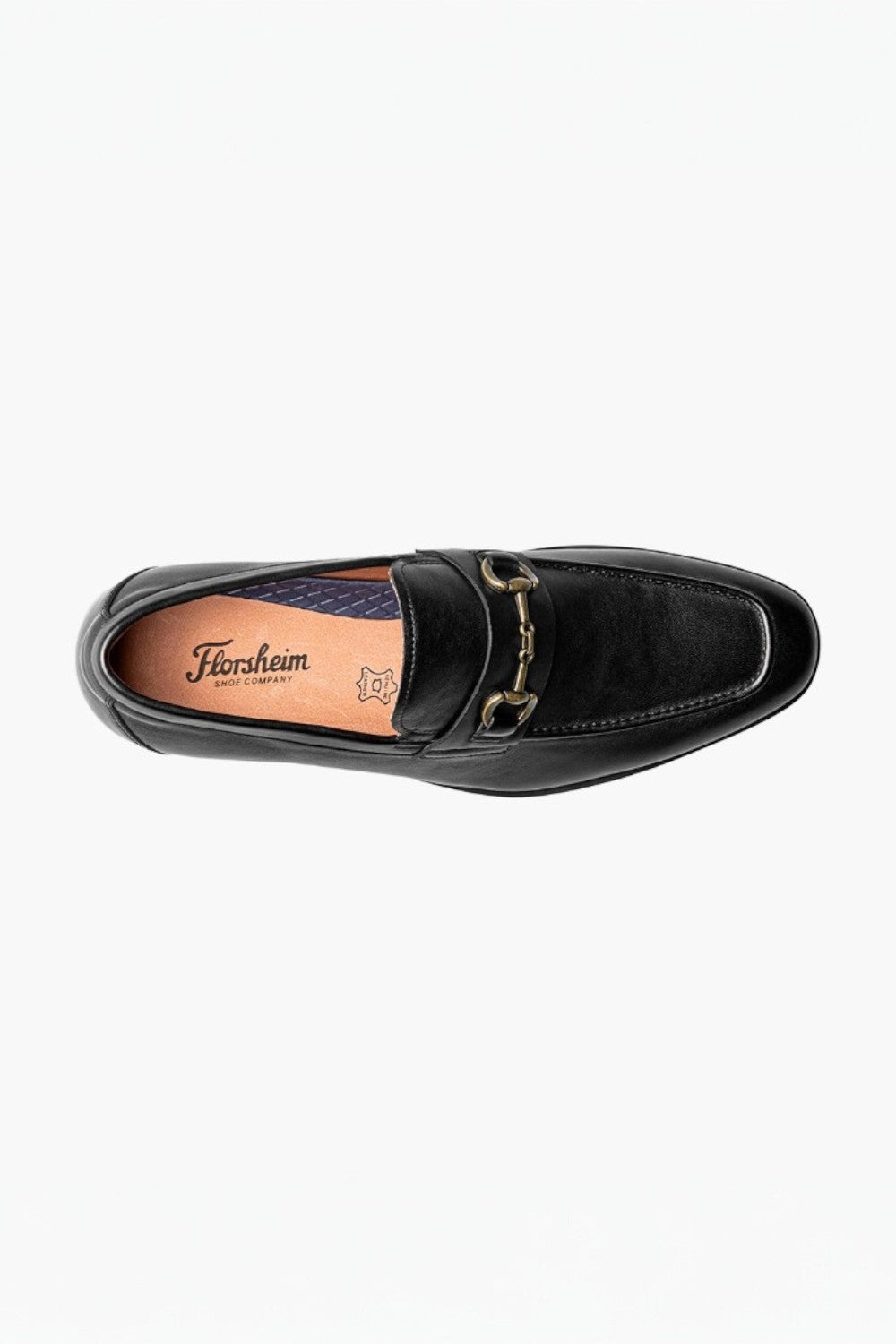 Black loafer shoe with gold buckle on a white background