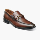 Brown leather loafer shoe on a white background