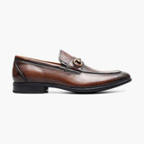 Black patent leather shoe with buckles on a white background