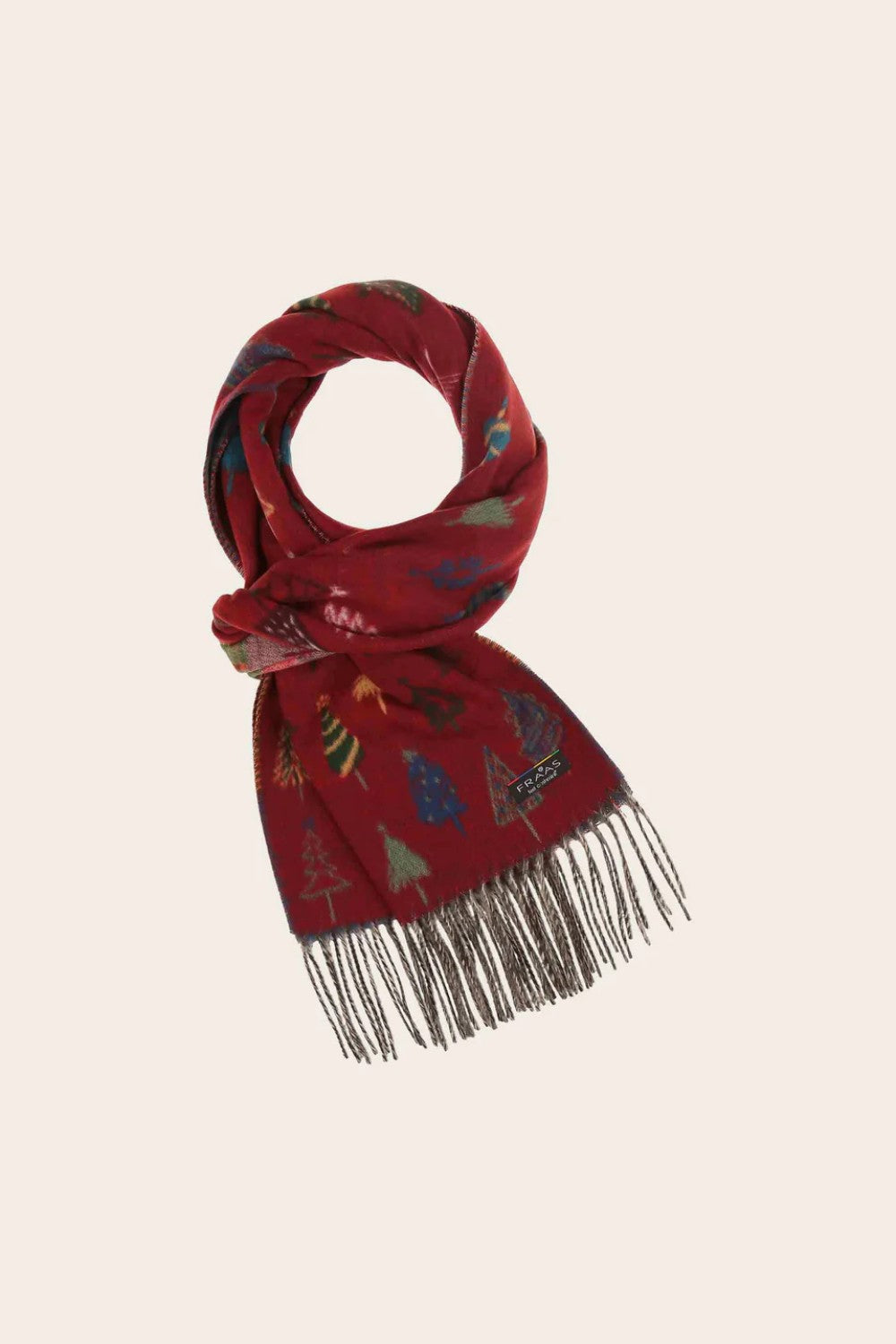 Red scarf with festive pattern on a beige background