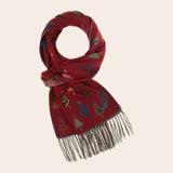 Red scarf with festive pattern on a beige background