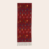 Red scarf with Christmas tree pattern on a white background