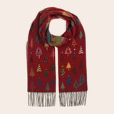Red scarf with Christmas tree patterns on a beige background