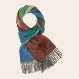 Colorful scarf with fringes on a beige background