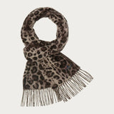 Leopard print scarf with fringes on a light gray background