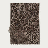 Leopard print scarf with fringes on a white background