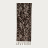 Leopard print scarf with fringes on a light gray background