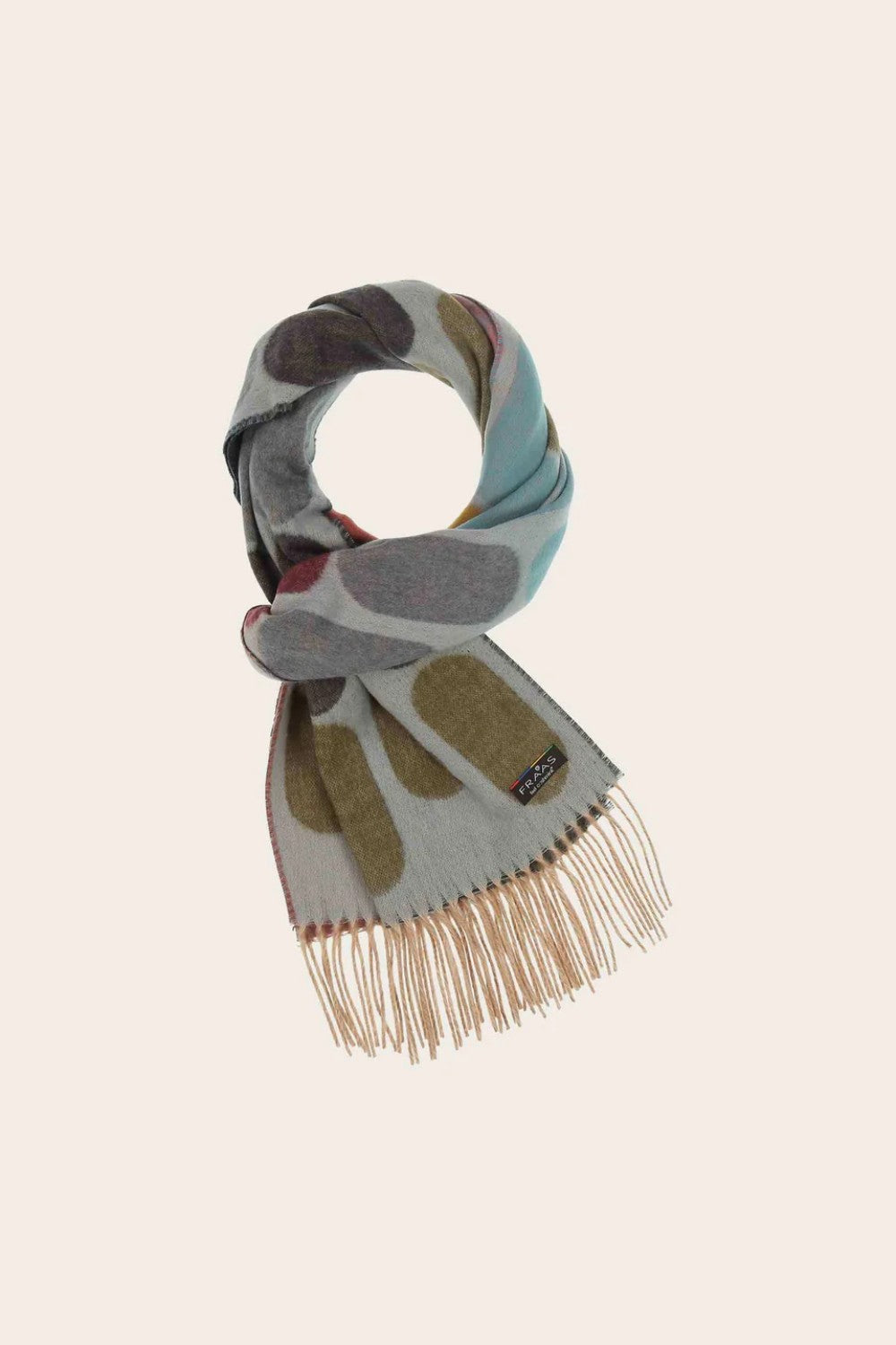 Patterned scarf with fringes on a beige background