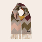 Multicolored zigzag patterned scarf with fringes on a beige background