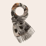 Patterned scarf with fringe on a beige background