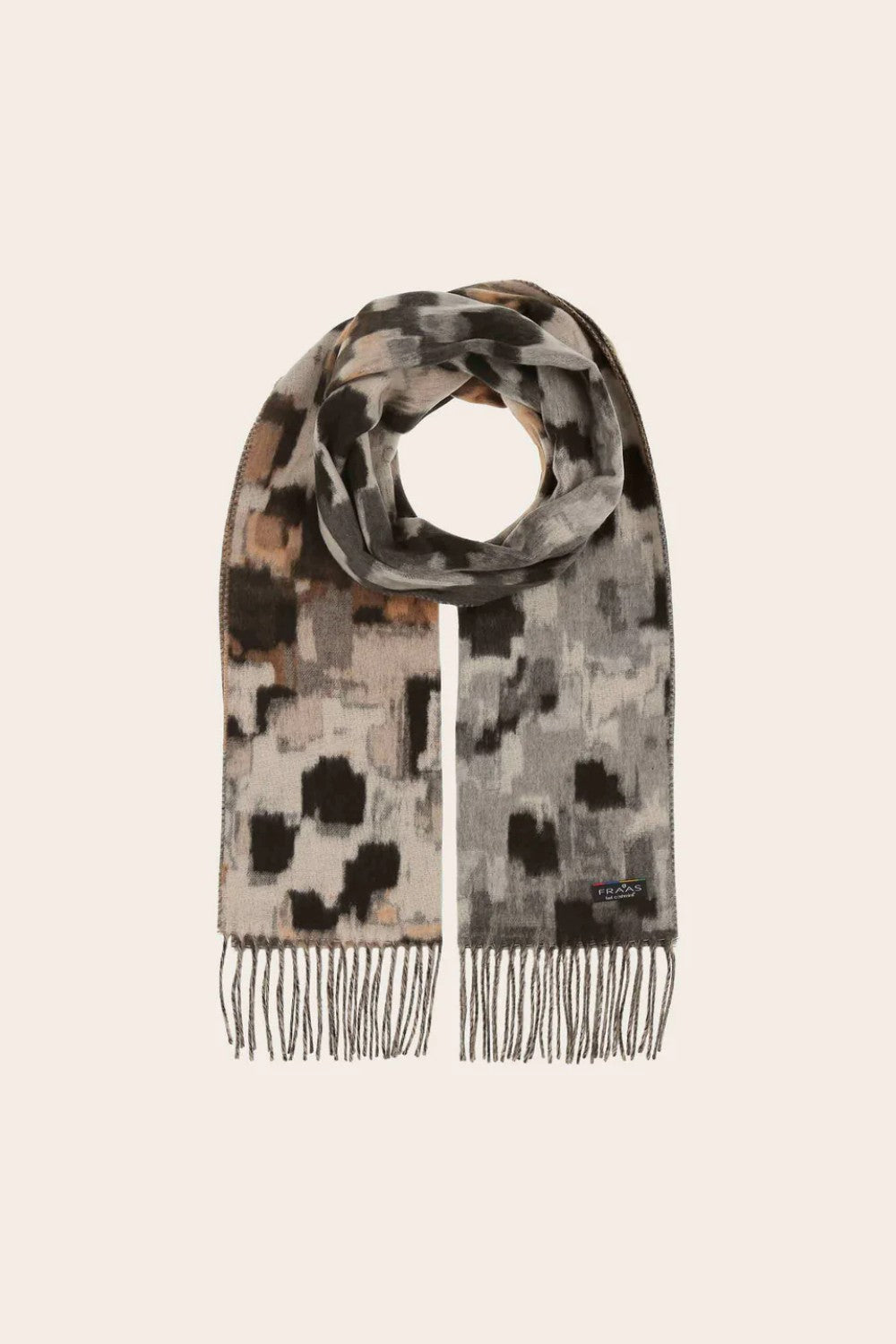 Patterned scarf with fringe on a beige background