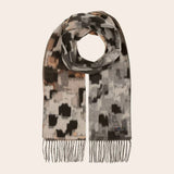 Patterned scarf with fringe on a beige background