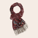 Patterned scarf with fringe on a beige background