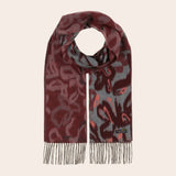 Patterned scarf with fringes on a beige background
