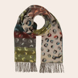 Multicolored patterned scarf with fringes on a beige background