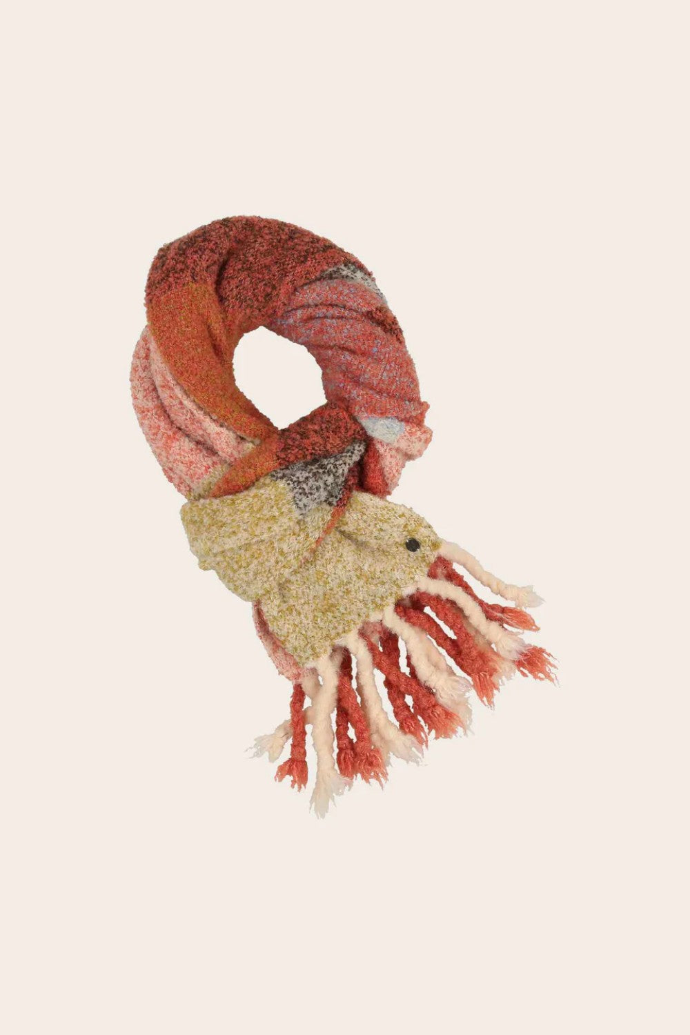 Knitted scarf with fringes on a beige background