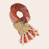 Knitted scarf with fringes on a beige background