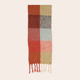 Checkered scarf with fringes on a beige background