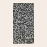 Scarf with black floral pattern on a beige background