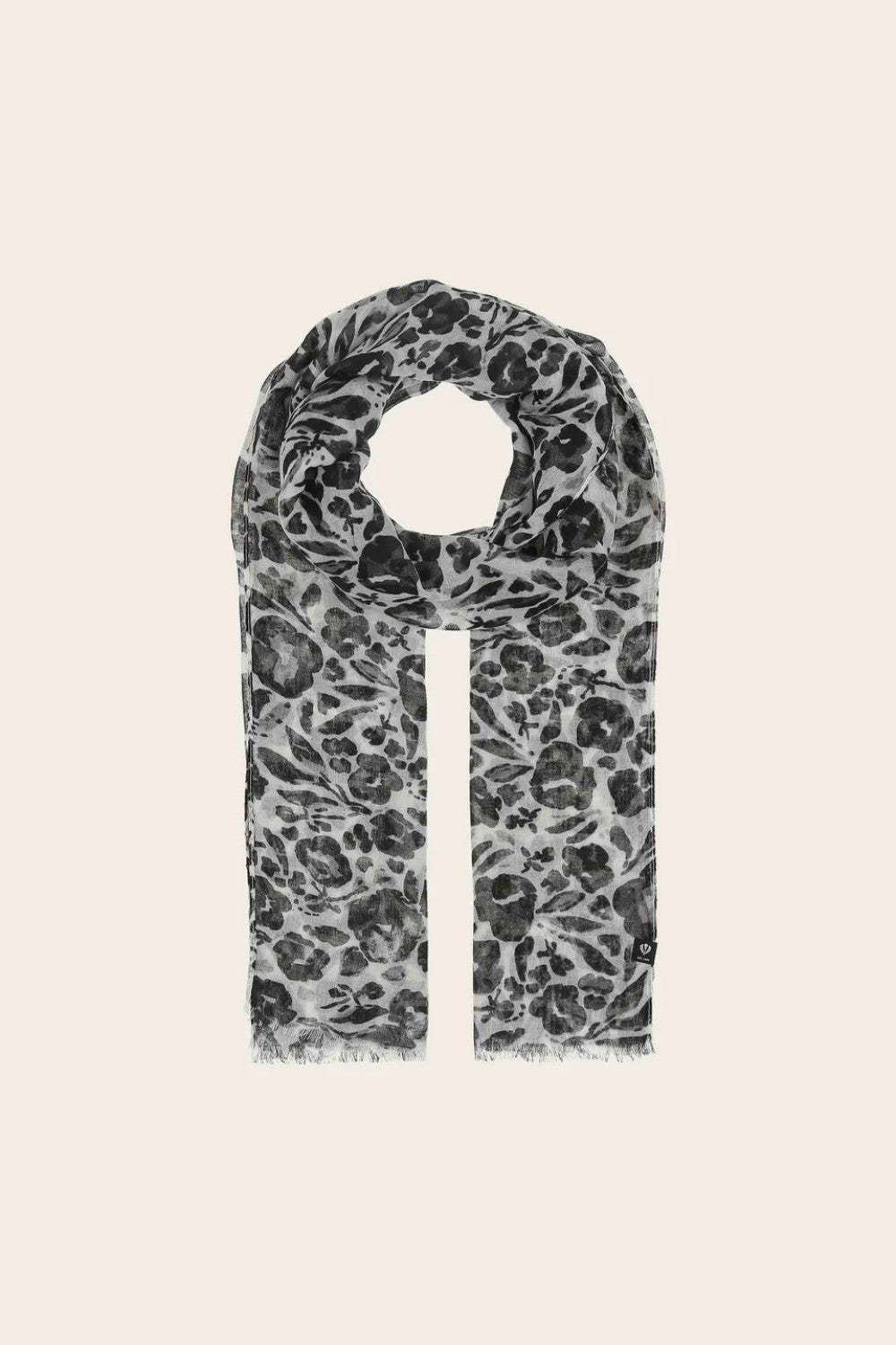 Scarf with black and white pattern on a beige background