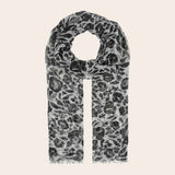 Scarf with black and white pattern on a beige background