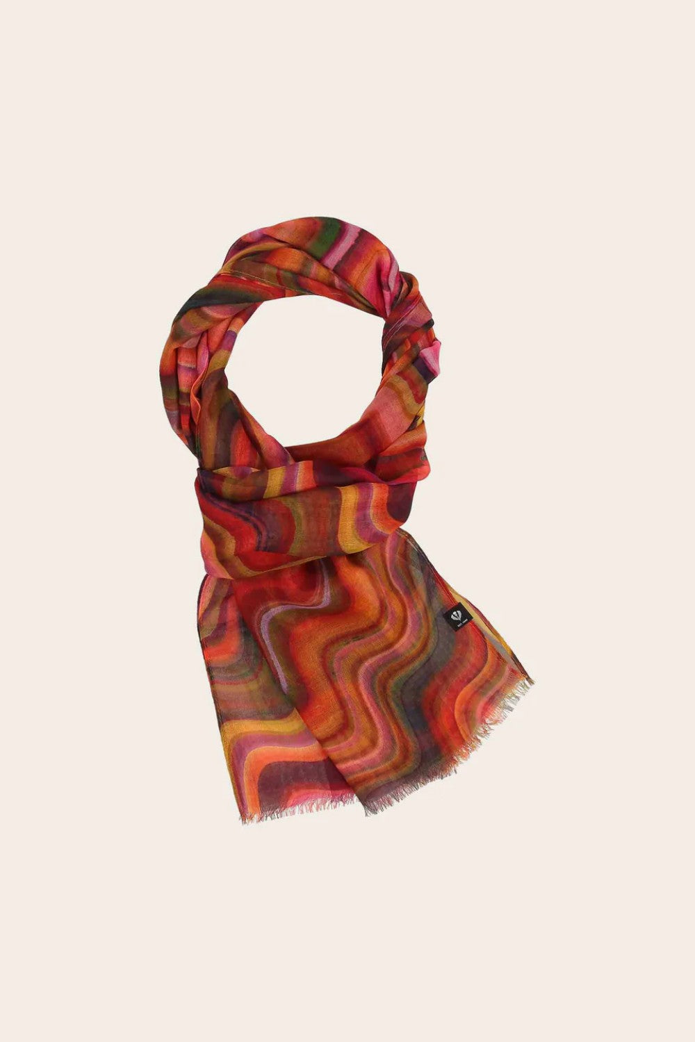 Colorful patterned scarf on a beige background