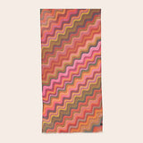 Colorful zigzag patterned scarf on a white background