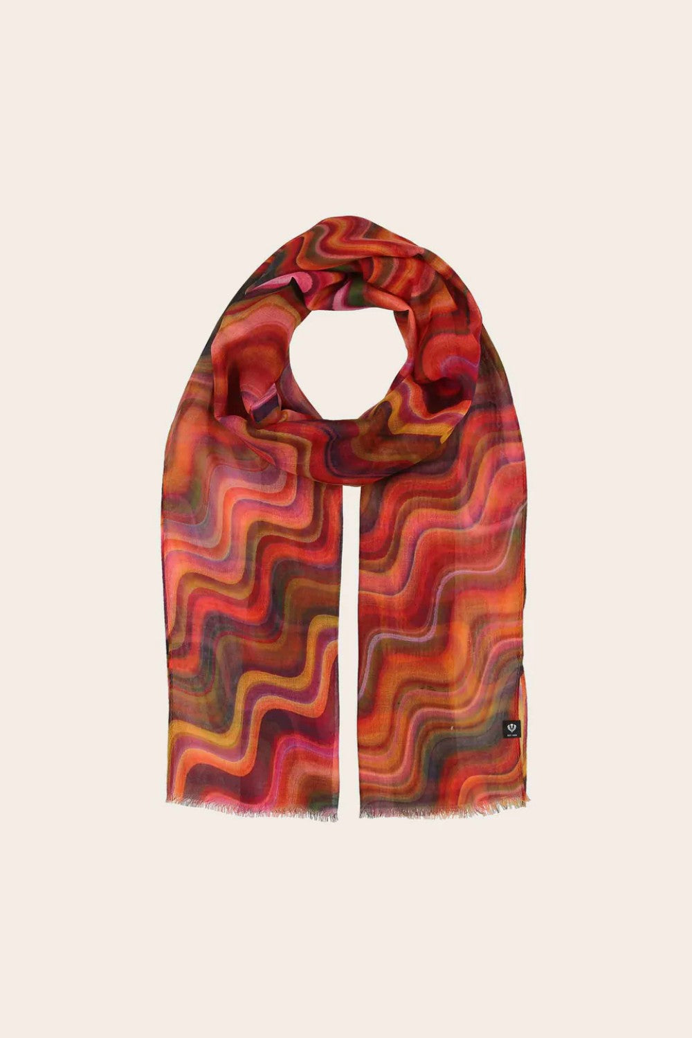 Colorful patterned scarf on a beige background