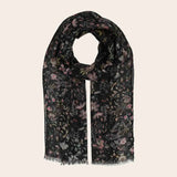 Black scarf with floral pattern on light background
