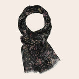 Black scarf with floral pattern on light background