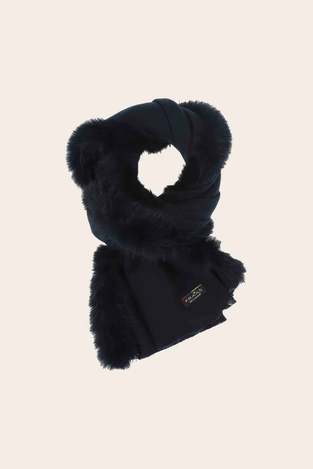 Black scarf with fluffy trim on a beige background