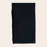 Black scarf on a beige background