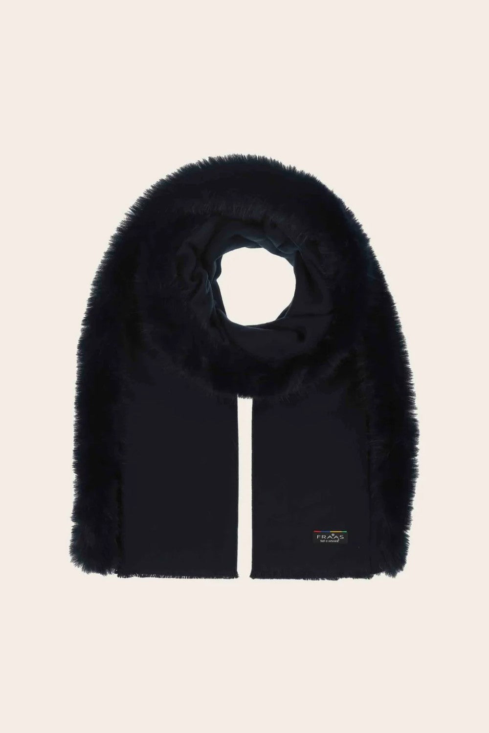 Black fur scarf with a brand label on a beige background