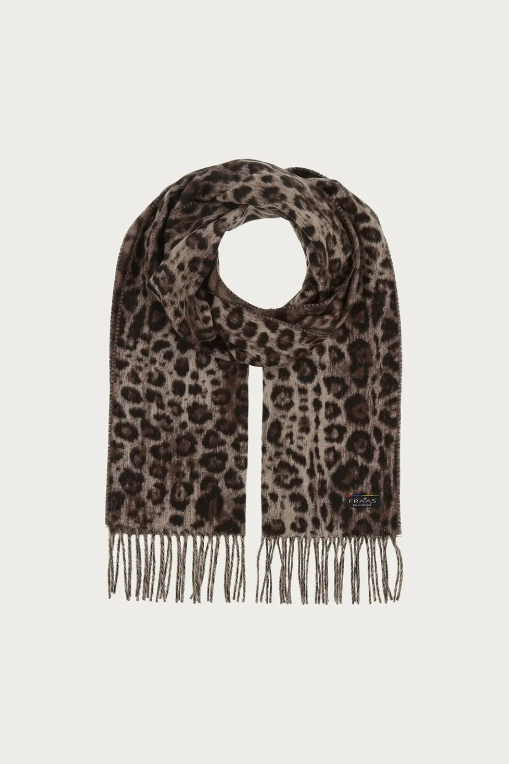 A leopard print scarf with fringe detailing, displayed on a clean, light off-white background. The pattern consists of dark brown and black spots on a warm taupe-brown base, with a small FRAAS logo tag visible near the bottom right edge.