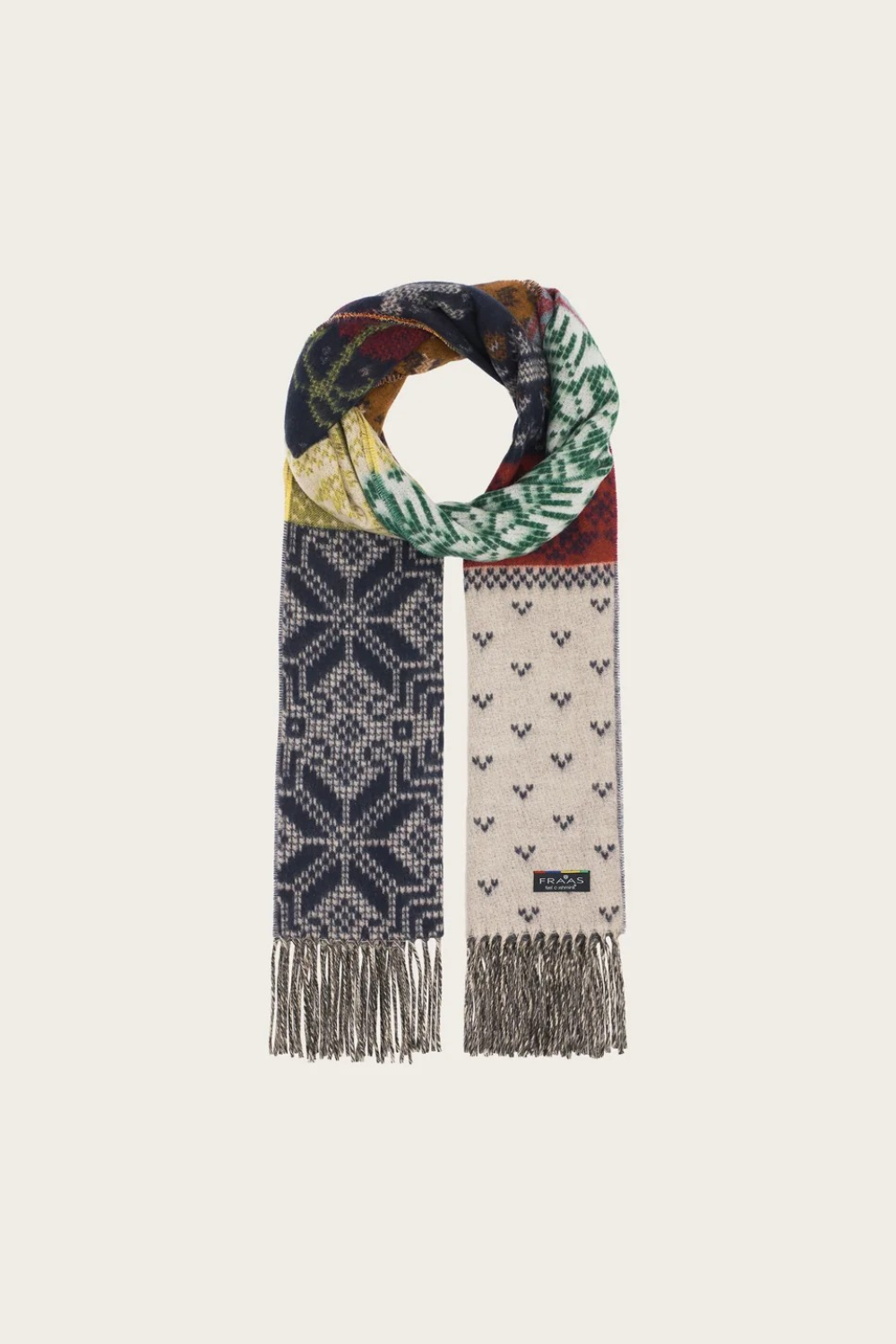A multi coloured winter themed scarf photographed against a light backdrop.