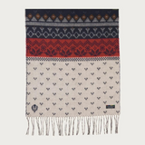 A multi coloured winter themed scarf with fringe photographed against a light backdrop.