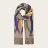 A beige based scarf with multi coloured brushstoke patterns, and fringe, photographed against a light backdrop.
