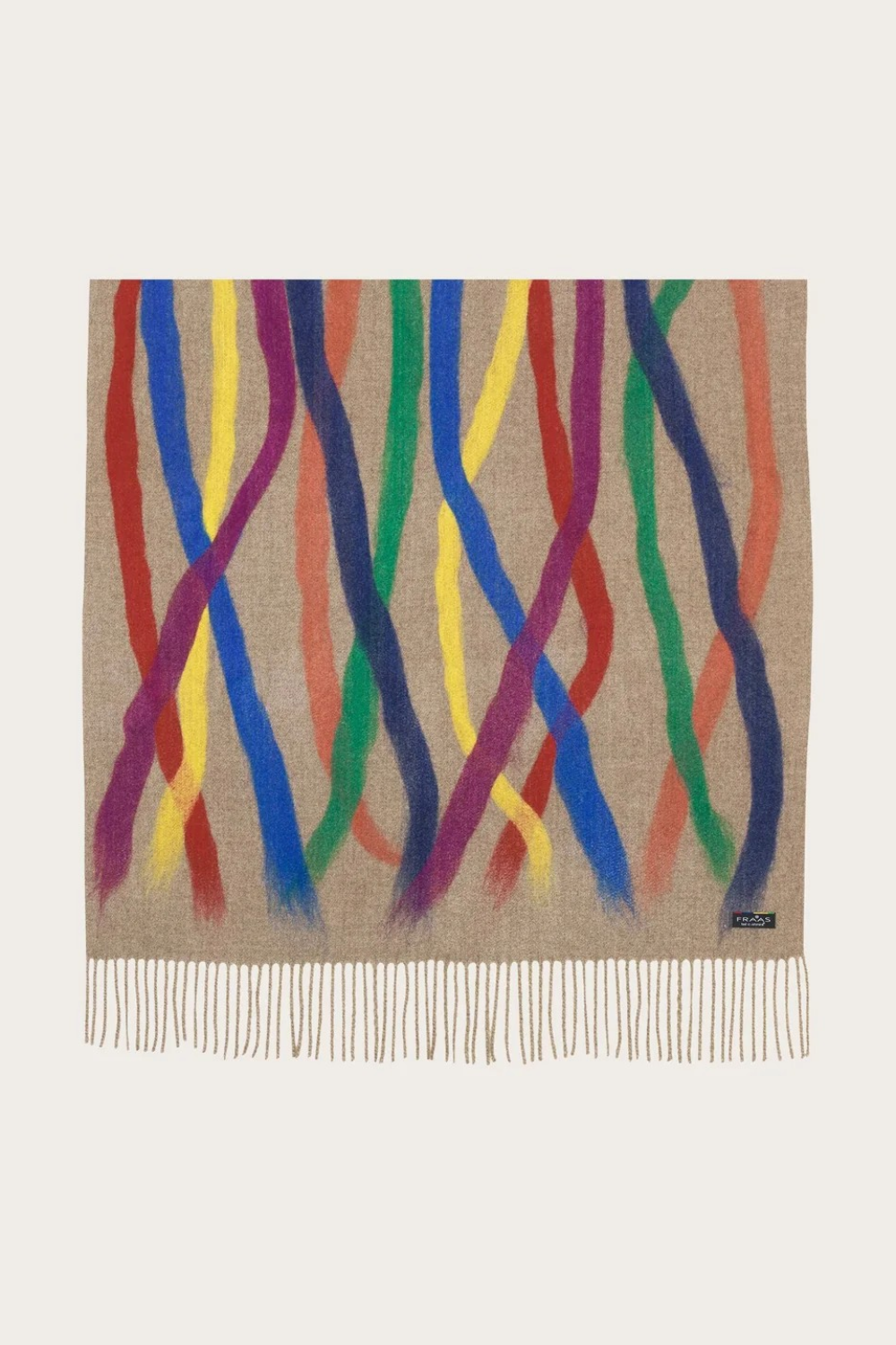 A beige based scarf with multi coloured brushstoke patterns, and fringe, photographed against a light backdrop.