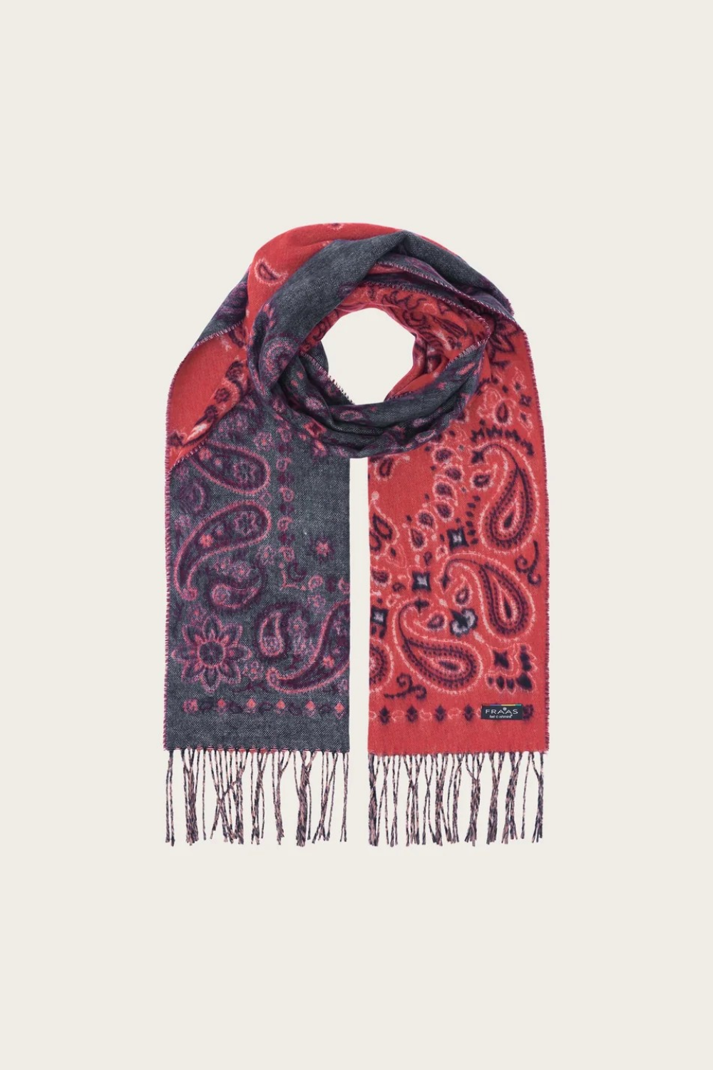 A red and grey paisley scarf, with fringe, photographed against a light background.